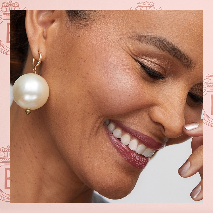 Image containing smiling Bride and Mother, showcasing the 'Mother of the Bride' makeup look