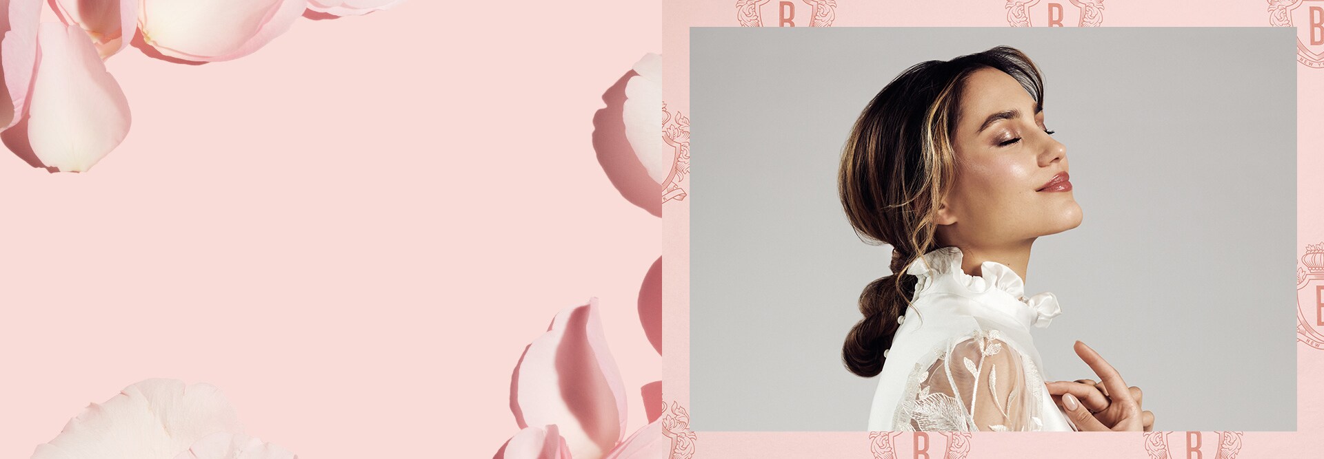 Hero banner visual showcasing smiling bride, surrounded by rose petals