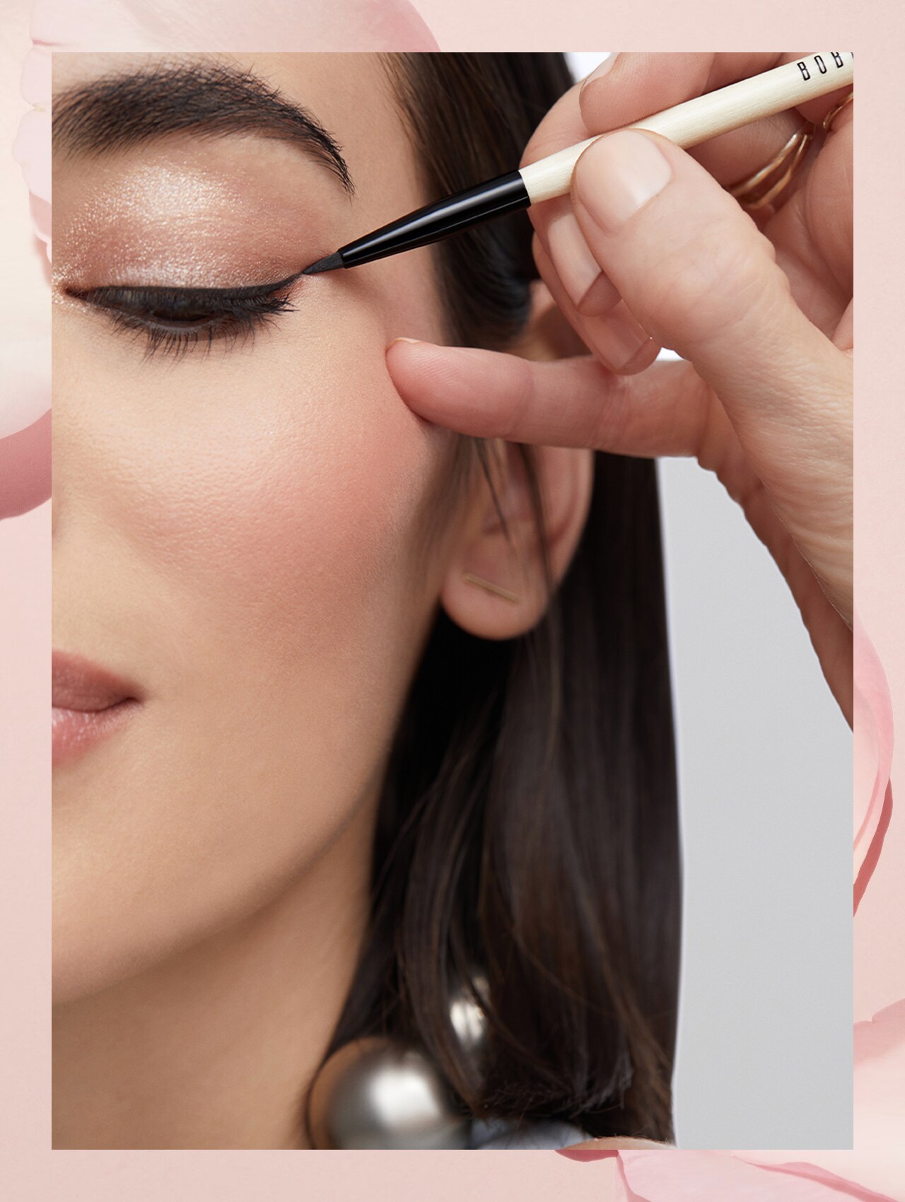 Imagine containing step 4 model having eye makeup applied by an artist